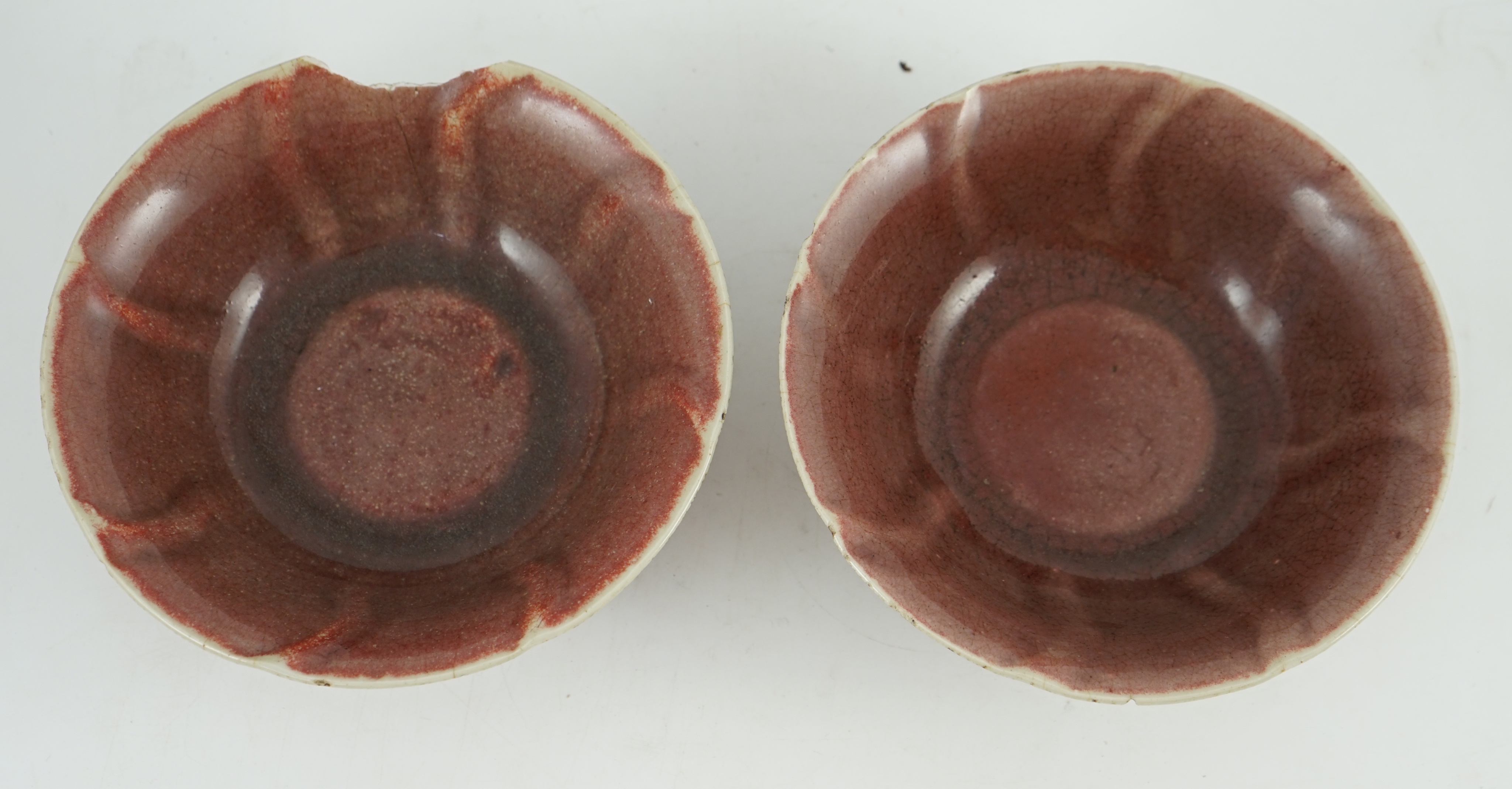 A pair of Chinese sang-de-boeuf glazed bowls, Langyao hong, Kangxi period, 19.5 cm diameter, some damage